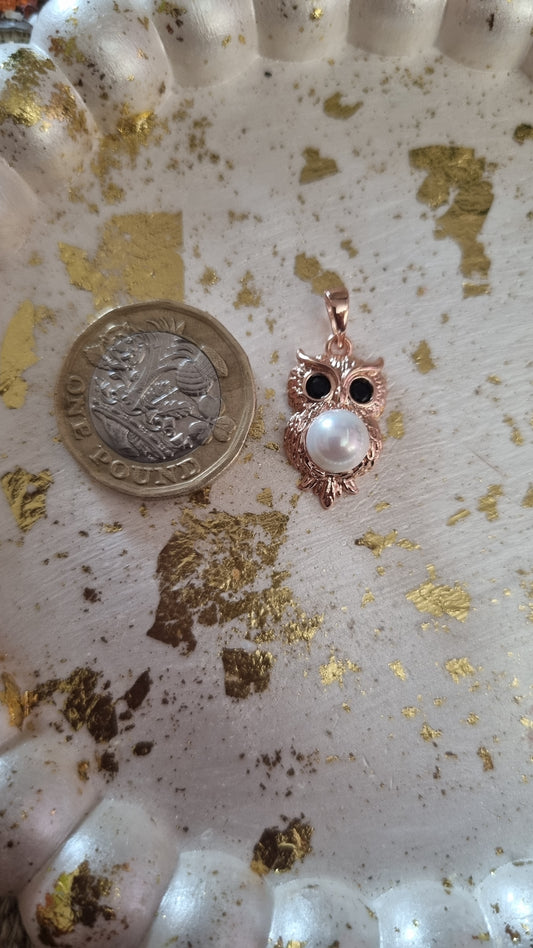 Rose gold plated with zircon crystals and natural fresh pearl
