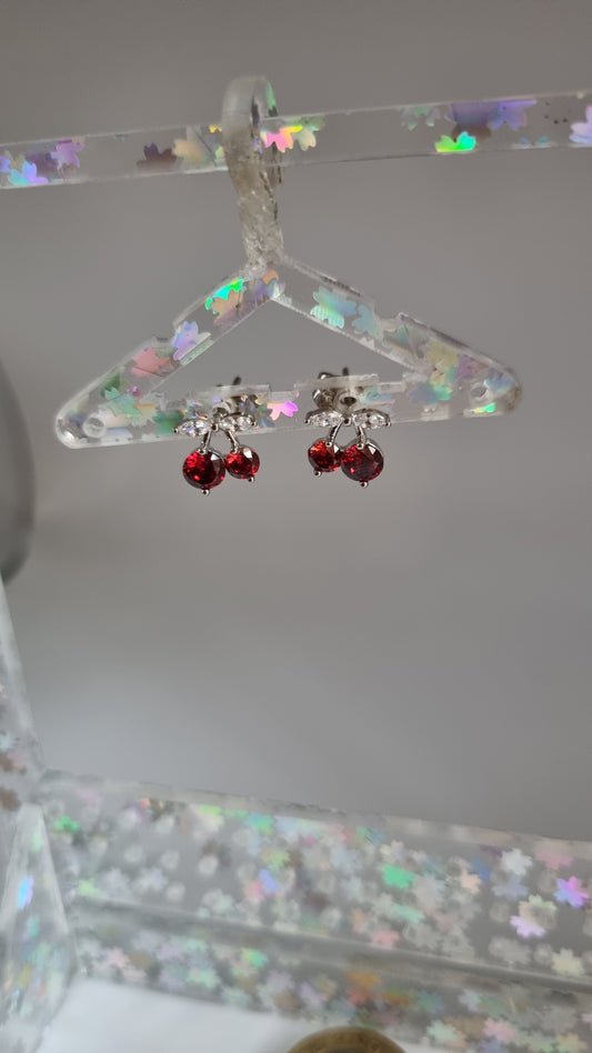 Platinum plated stud earrings with granet color zircon stone and white