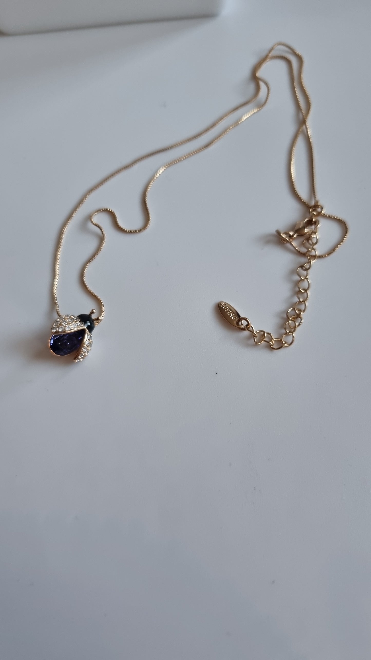 18kr.gold plated necklace with sw.crystal  purple butterfly